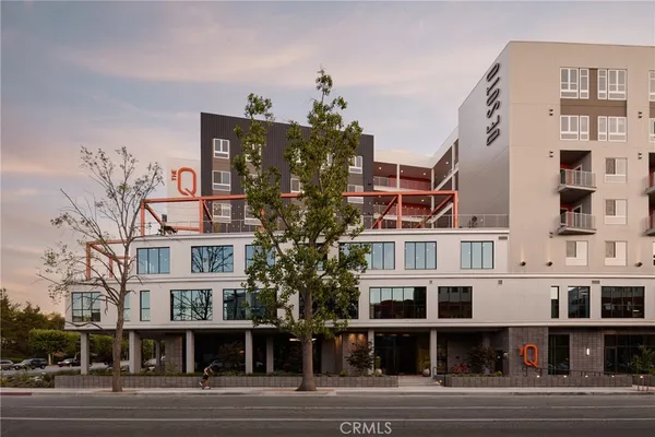 a view of a big building next to a road