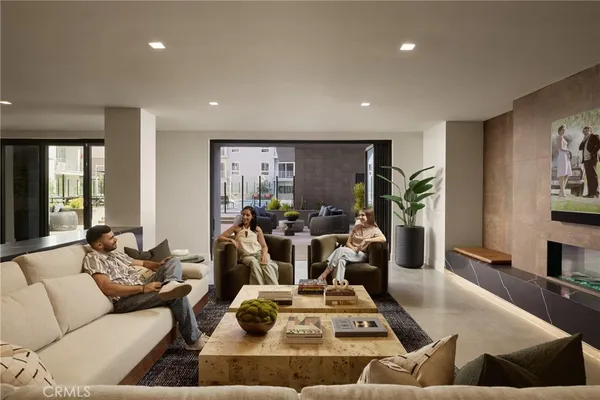 a kitchen with a table chairs stove and refrigerator