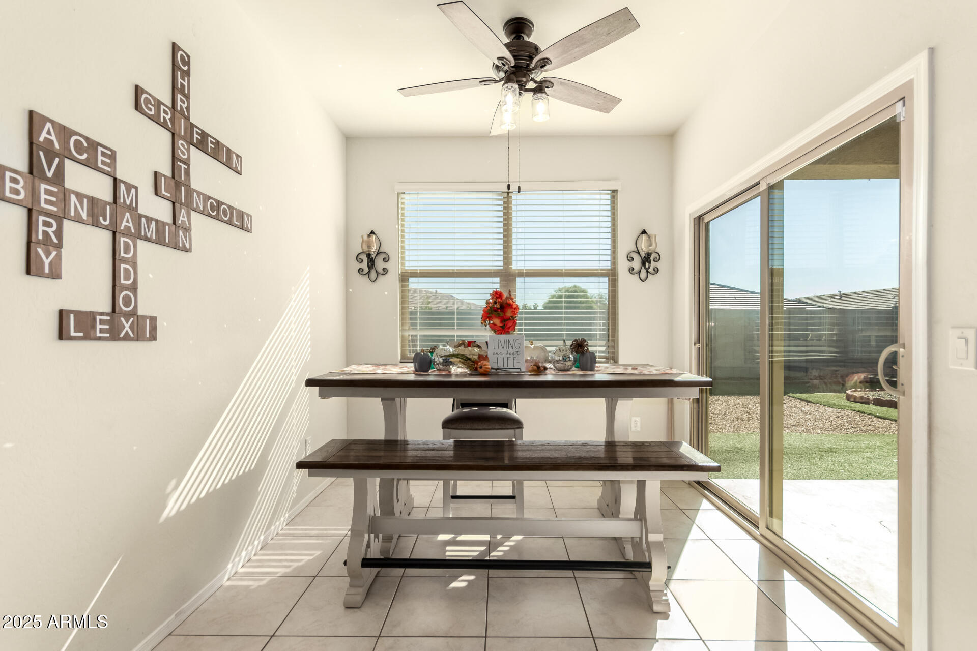 30879 West Picadilly Road Buckeye, AZ 85396 - Photo 11 of 34 a kitchen with stainless steel appliances kitchen island granite countertop a stove a sink and a refrigerator