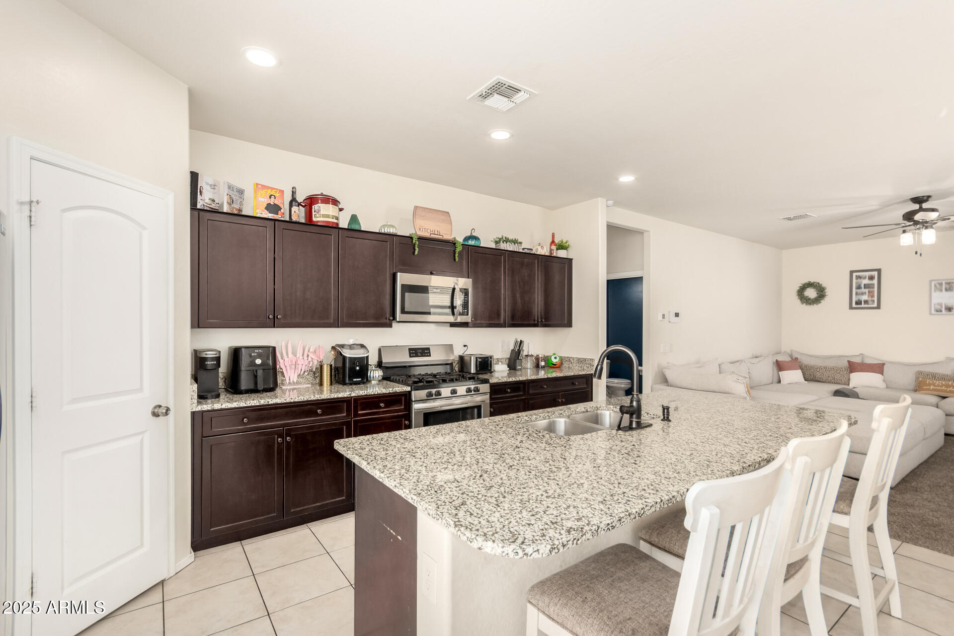 30879 West Picadilly Road Buckeye, AZ 85396 - Photo 14 of 34 a kitchen with counter space cabinets and appliances