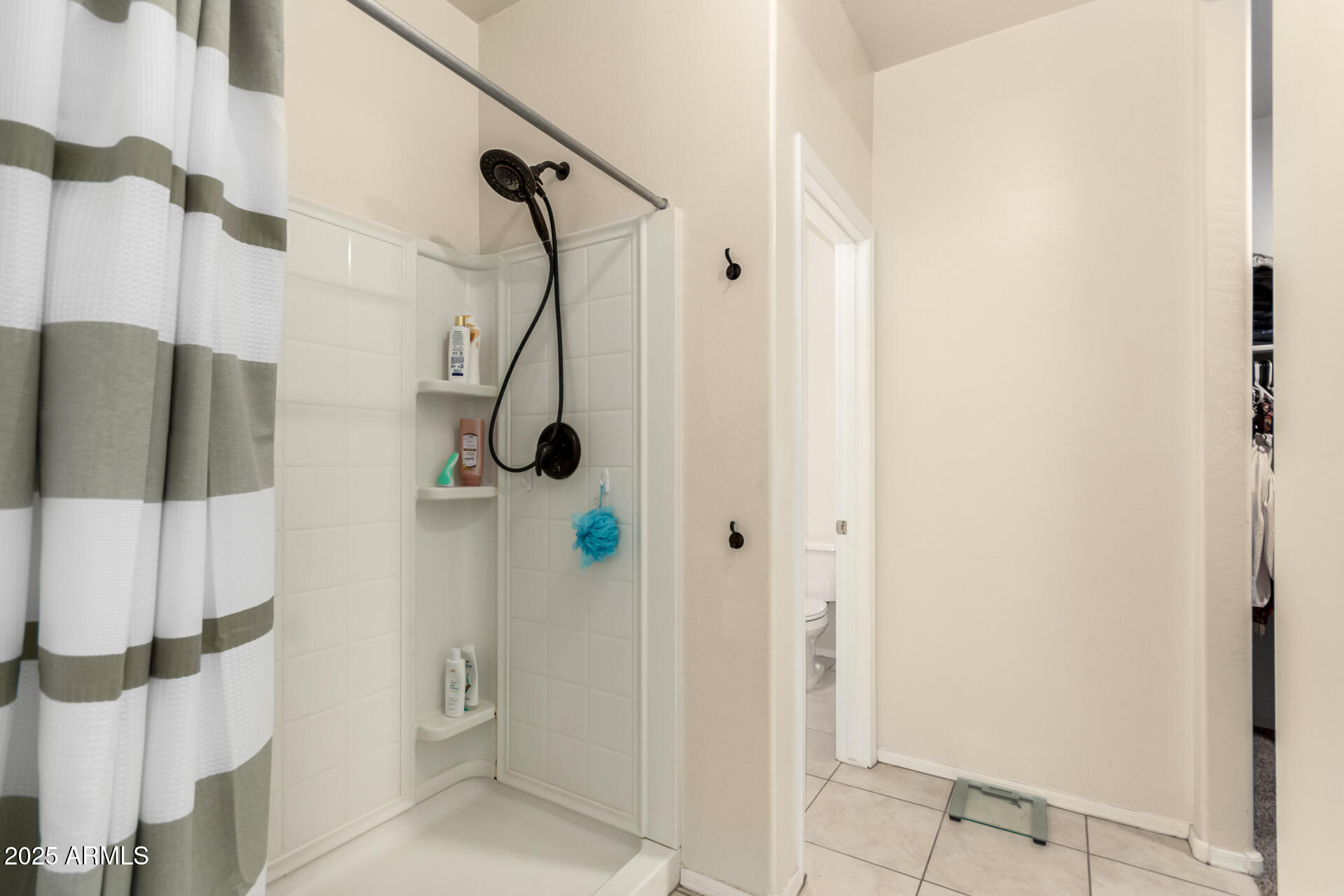 30879 West Picadilly Road Buckeye, AZ 85396 - Photo 23 of 34 a bathroom with a shower
