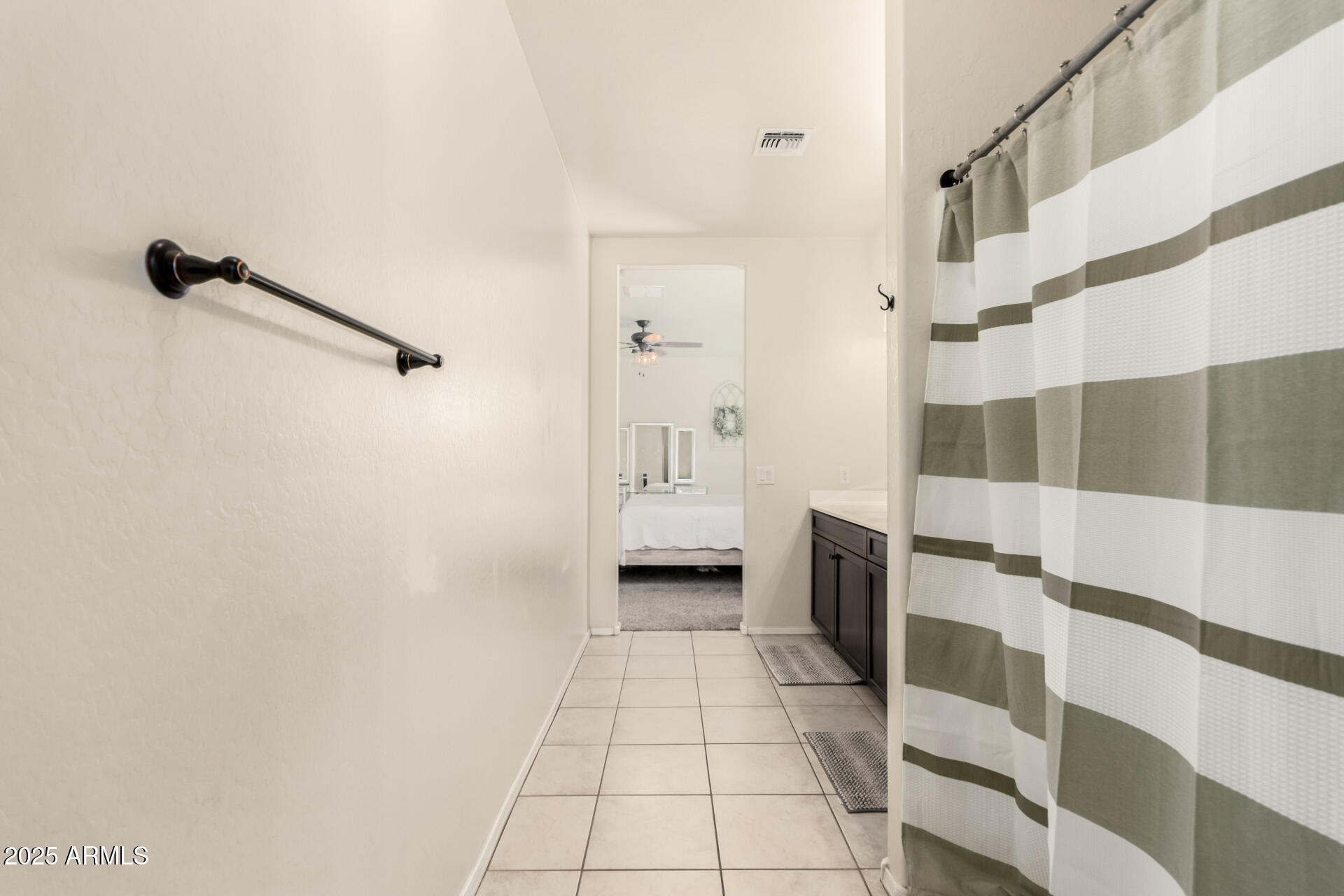 30879 West Picadilly Road Buckeye, AZ 85396 - Photo 24 of 34 a bathroom with a sink and a shower