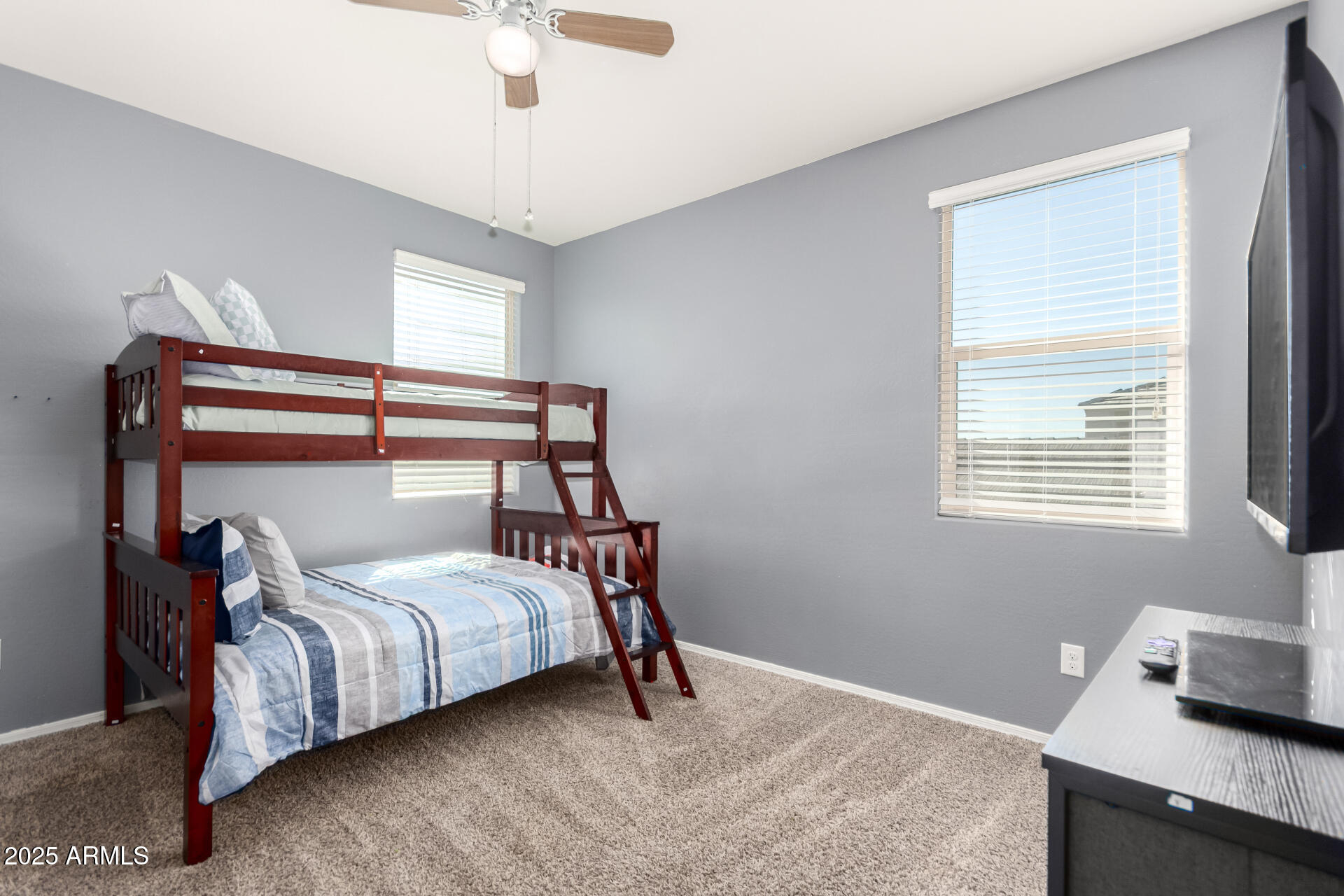 30879 West Picadilly Road Buckeye, AZ 85396 - Photo 25 of 34 a bedroom with a bed and a window