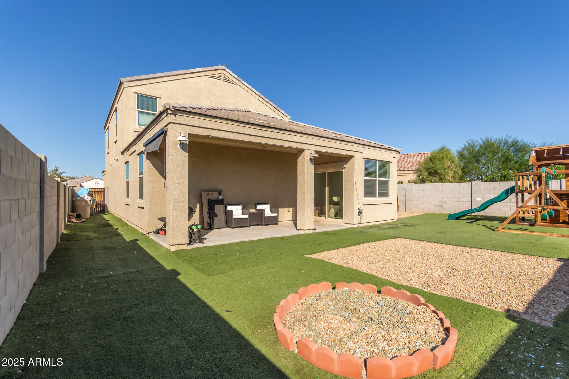 30879 West Picadilly Road Buckeye, AZ 85396 - Photo 32 of 34 a view of a house with a yard