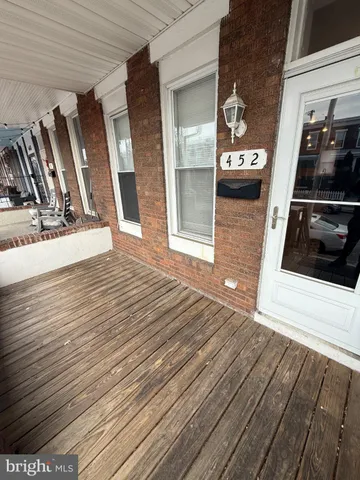 a view of a balcony with car parked
