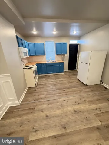 a view of a kitchen with a sink