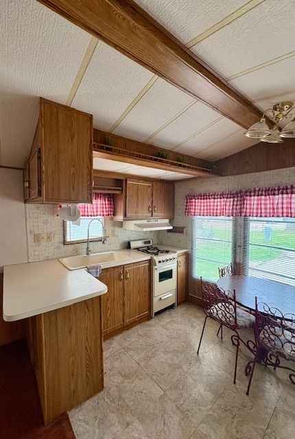 5-101 Woodhaven Sublette, IL 61367 - Photo 12 of 23 a kitchen with stainless steel appliances a sink counter top space cabinets and wooden floor