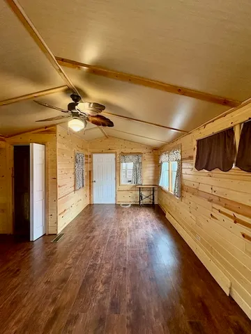 a view of a livingroom with wooden floor