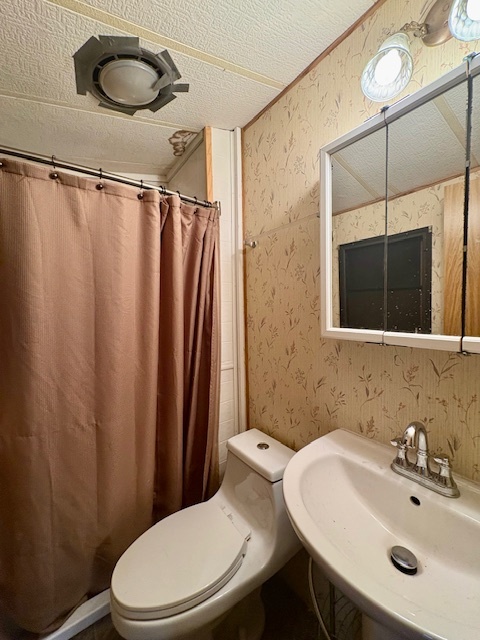 5-101 Woodhaven Sublette, IL 61367 - Photo 22 of 23 a bathroom with a sink mirror and toilet