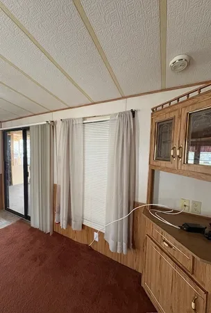 a kitchen with stainless steel appliances granite countertop a refrigerator and a stove