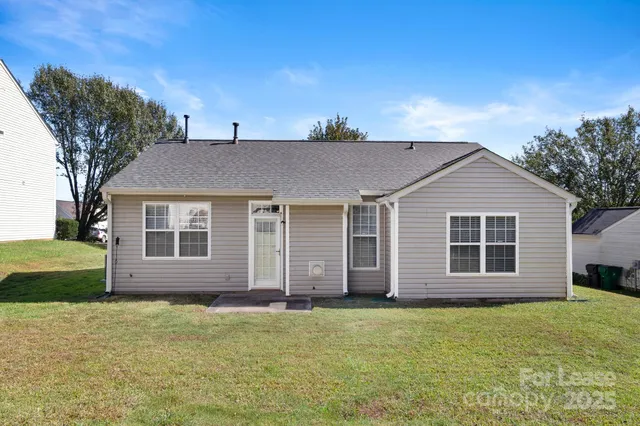 a picture of a bench in front of a wall