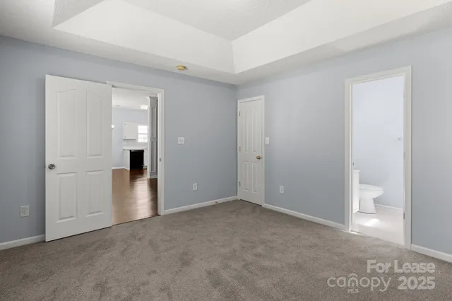 a view of an empty room with a bathroom