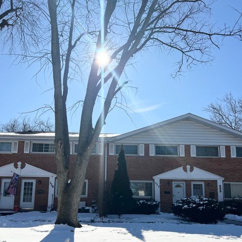 a front view of a house with yard