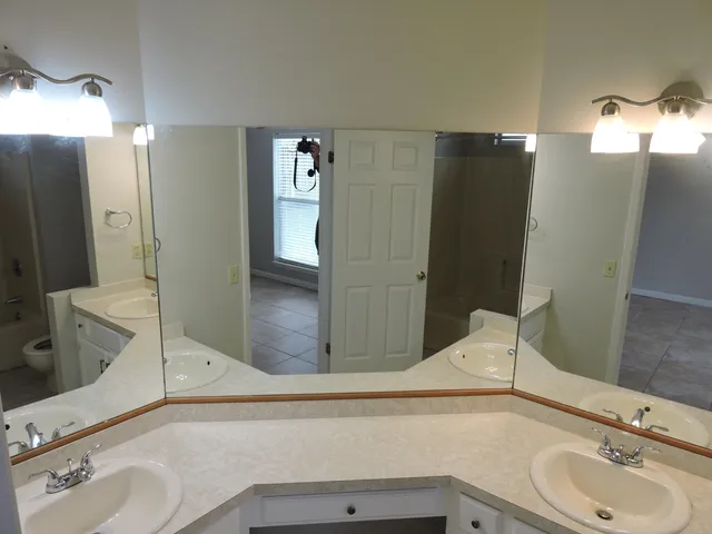 a bathroom with a sink and mirror