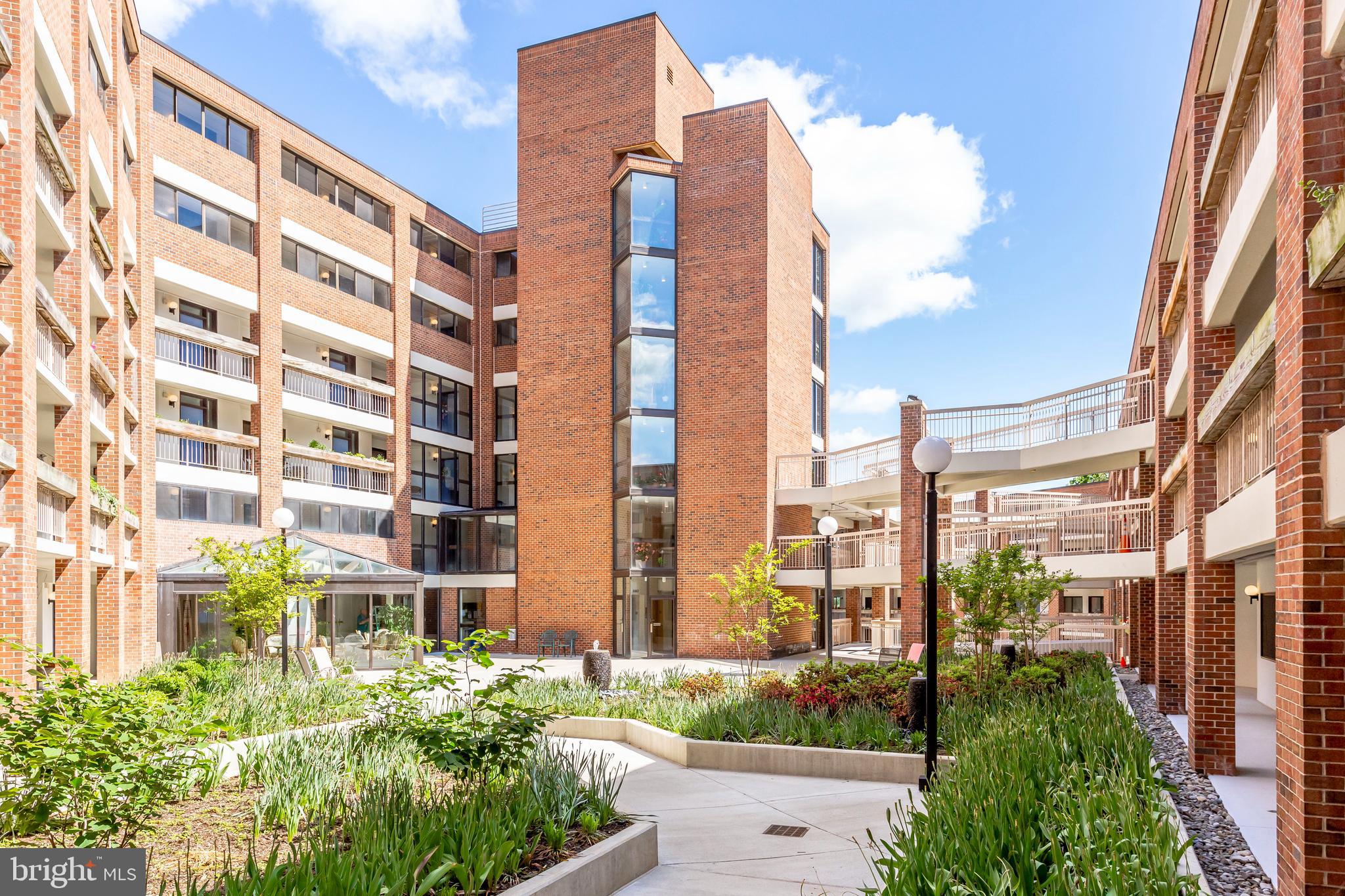 1951 Sagewood Lane, Unit 517 Reston, VA 20191 - Photo 43 of 50 Another view of the building and courtyard.