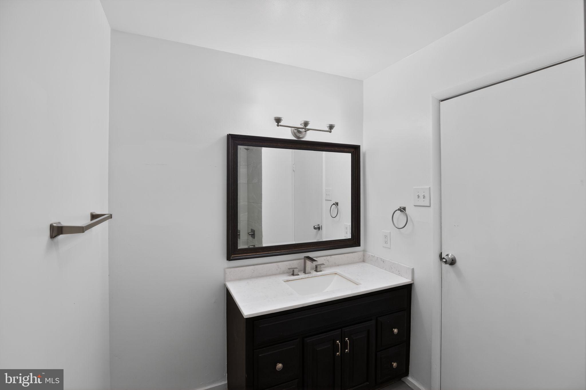 9276 Soaring Hill Road Columbia, MD 21045 - Photo 15 of 27 a bathroom with a sink and a mirror