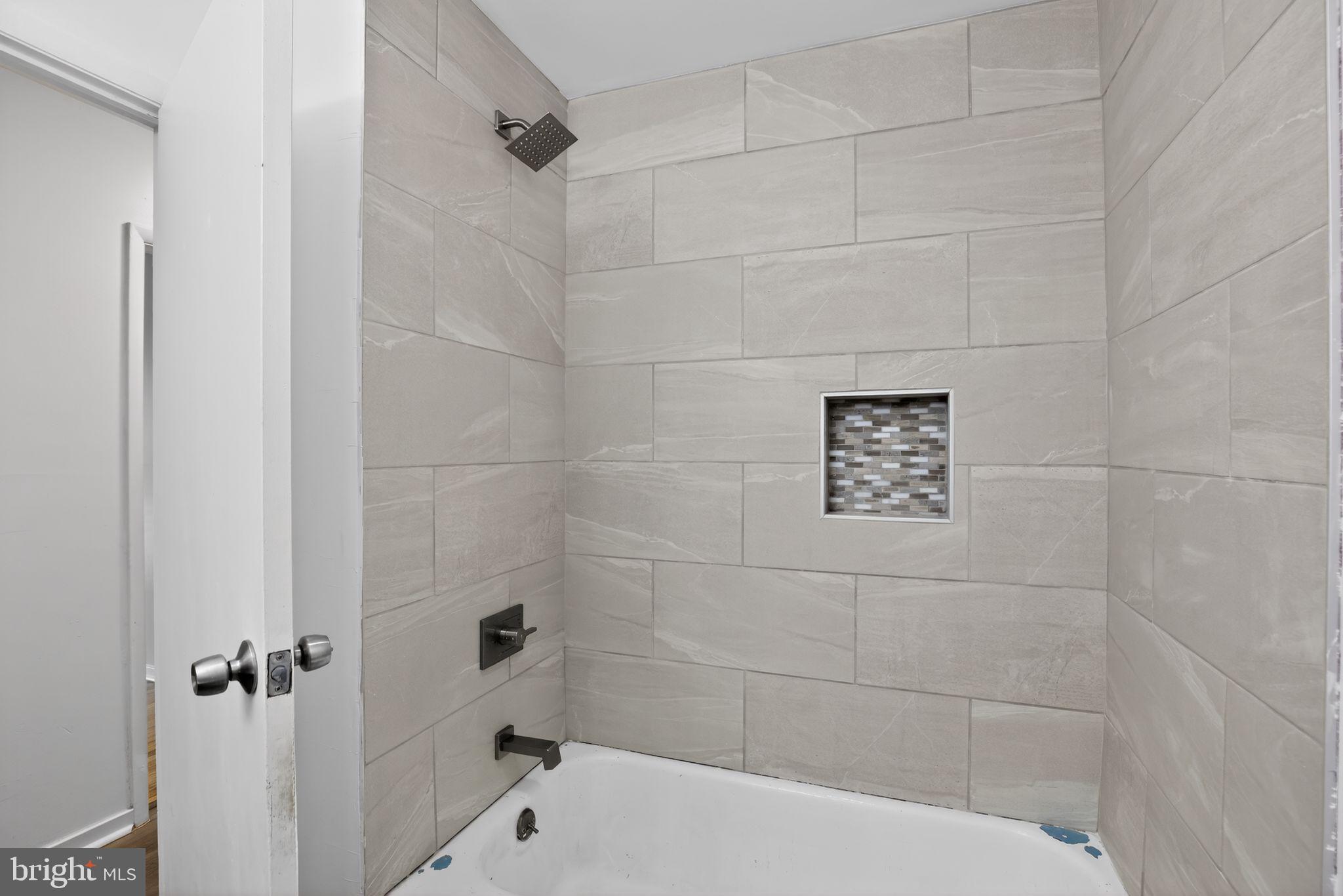 9276 Soaring Hill Road Columbia, MD 21045 - Photo 16 of 27 a bathroom with a shower and a toilet