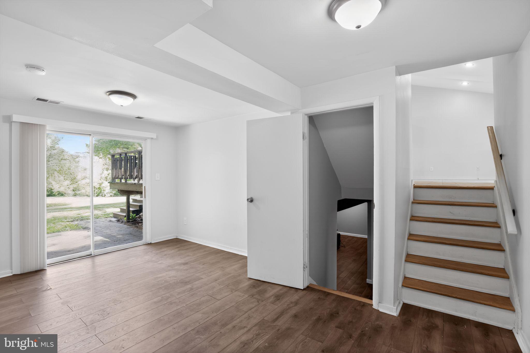 9276 Soaring Hill Road Columbia, MD 21045 - Photo 17 of 27 an empty room with wooden floor and windows