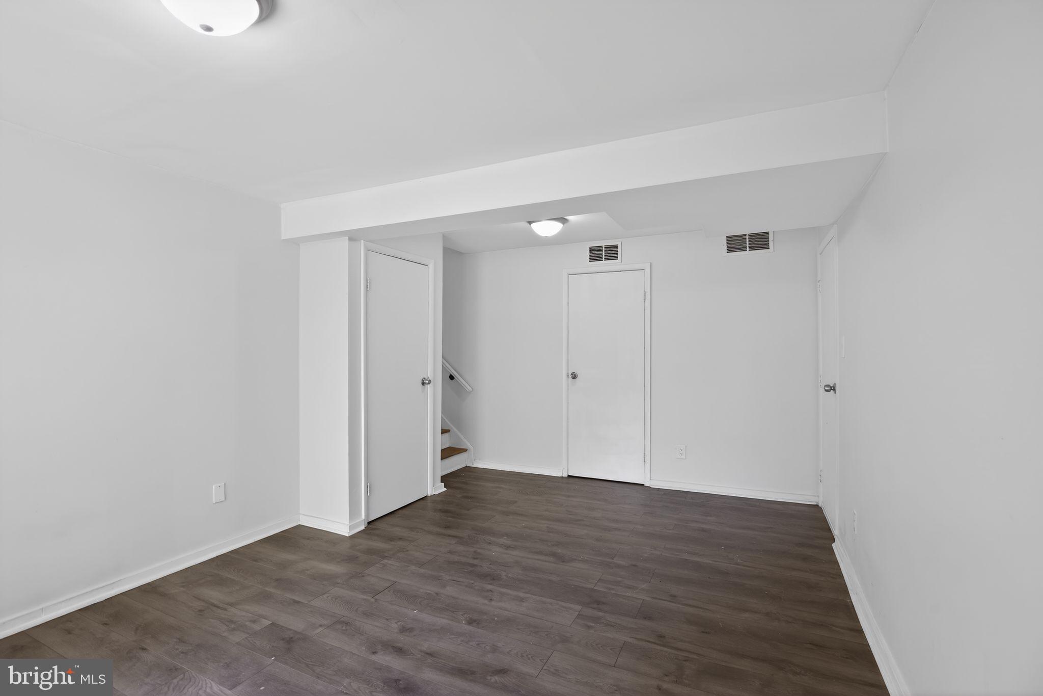 9276 Soaring Hill Road Columbia, MD 21045 - Photo 19 of 27 a view of an empty room with wooden floor