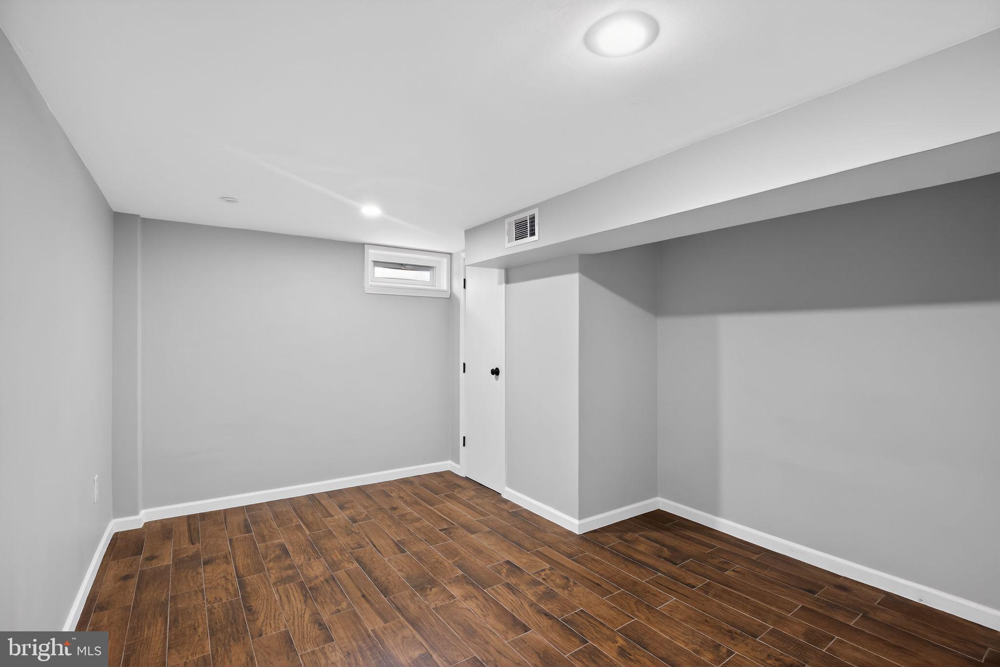 9276 Soaring Hill Road Columbia, MD 21045 - Photo 21 of 27 a view of empty room with wooden floor