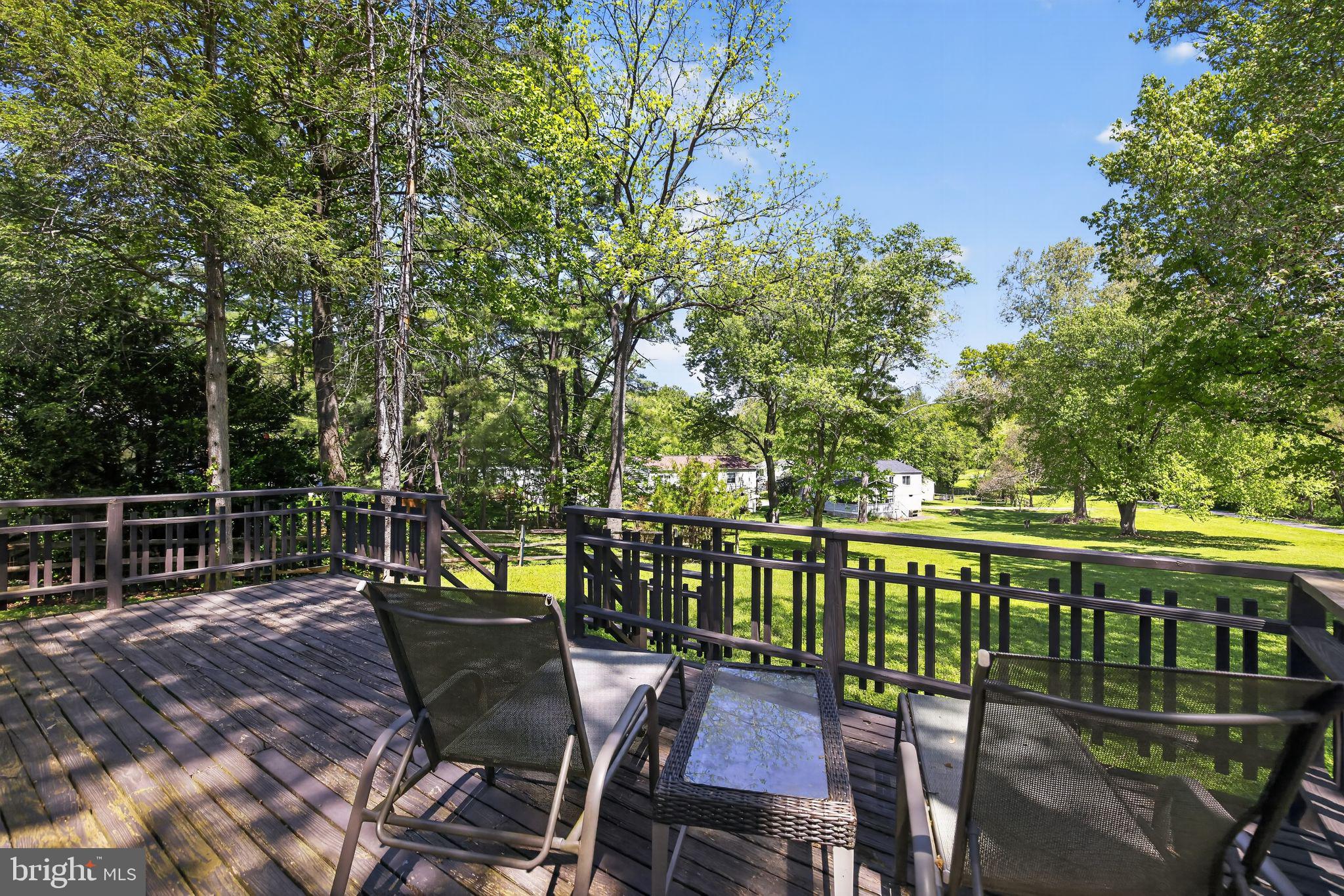 9276 Soaring Hill Road Columbia, MD 21045 - Photo 26 of 27 a view of a chairs and table on the deck