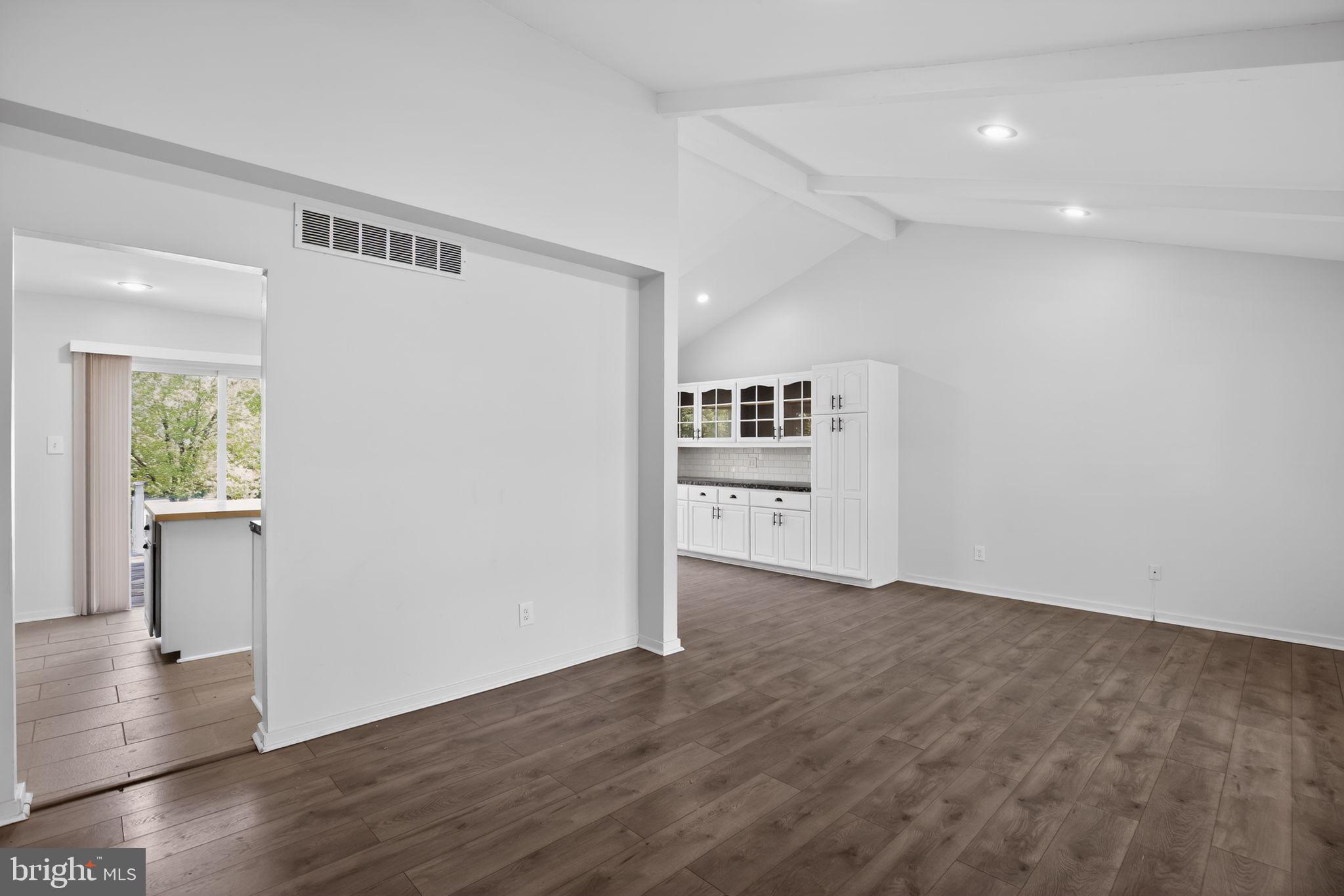 9276 Soaring Hill Road Columbia, MD 21045 - Photo 4 of 27 a view of a kitchen with wooden floor and a window
