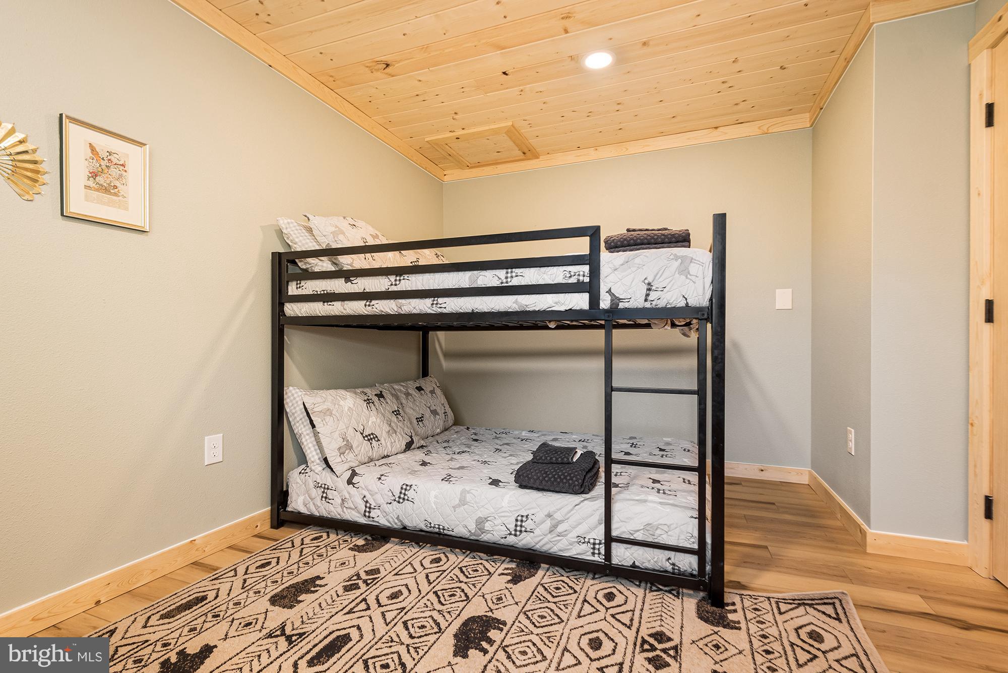 1015 Pysell Road McHenry, MD 21541 - Photo 17 of 56 a bedroom with a bed and a window