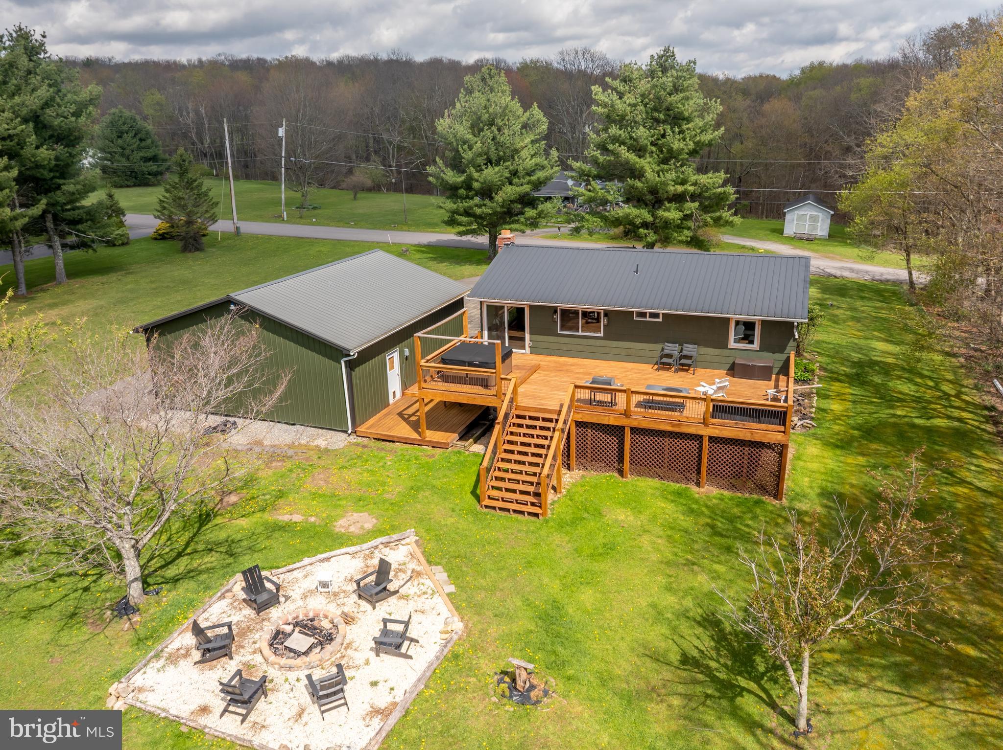 1015 Pysell Road McHenry, MD 21541 - Photo 2 of 56 a aerial view of a house with garden space and a patio