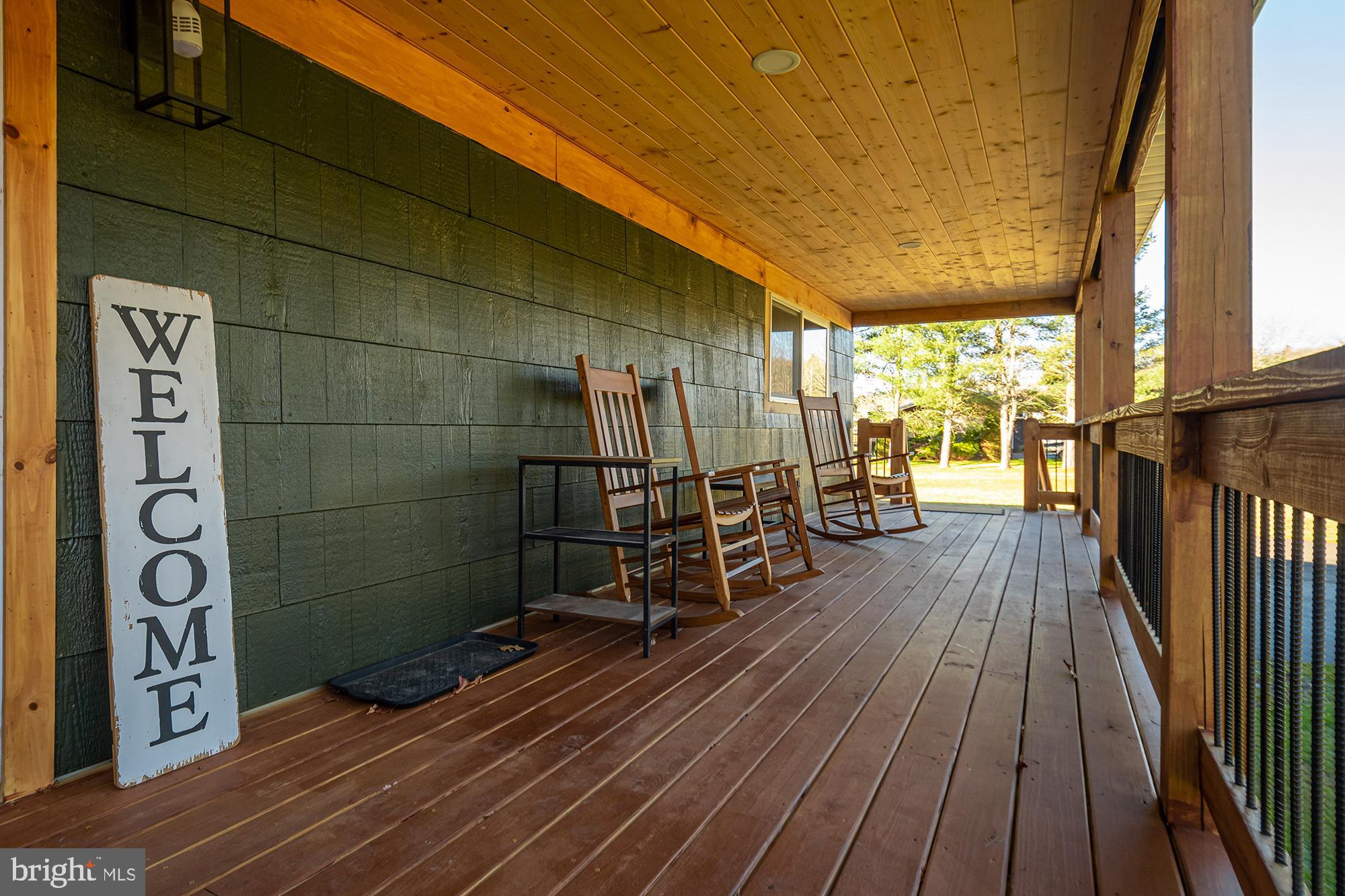 1015 Pysell Road McHenry, MD 21541 - Photo 37 of 56 a view of a balcony with wooden floor