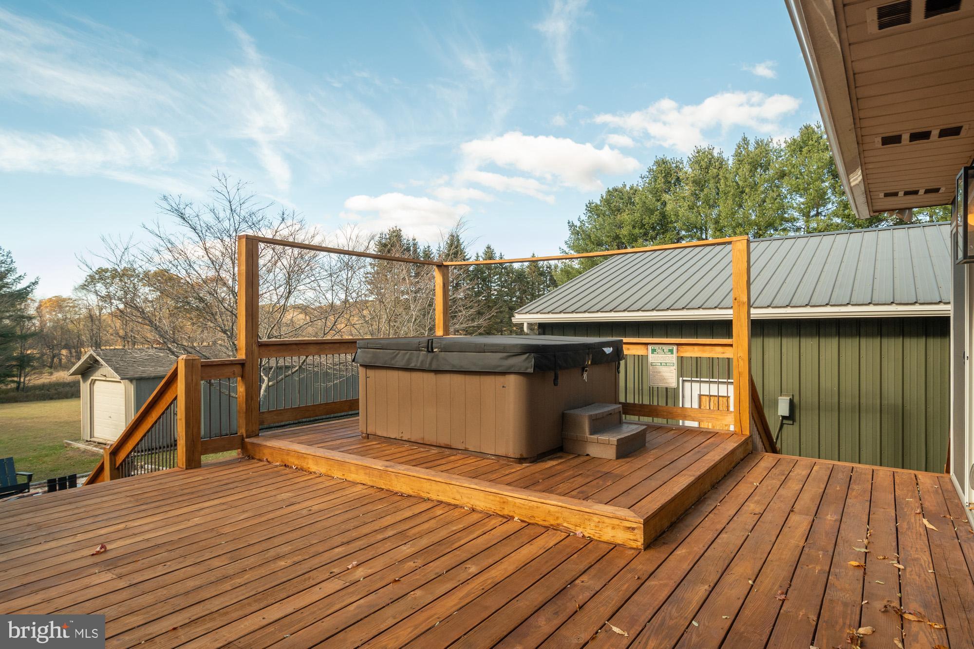 1015 Pysell Road McHenry, MD 21541 - Photo 43 of 56 a view of a roof deck with wooden floor and fence