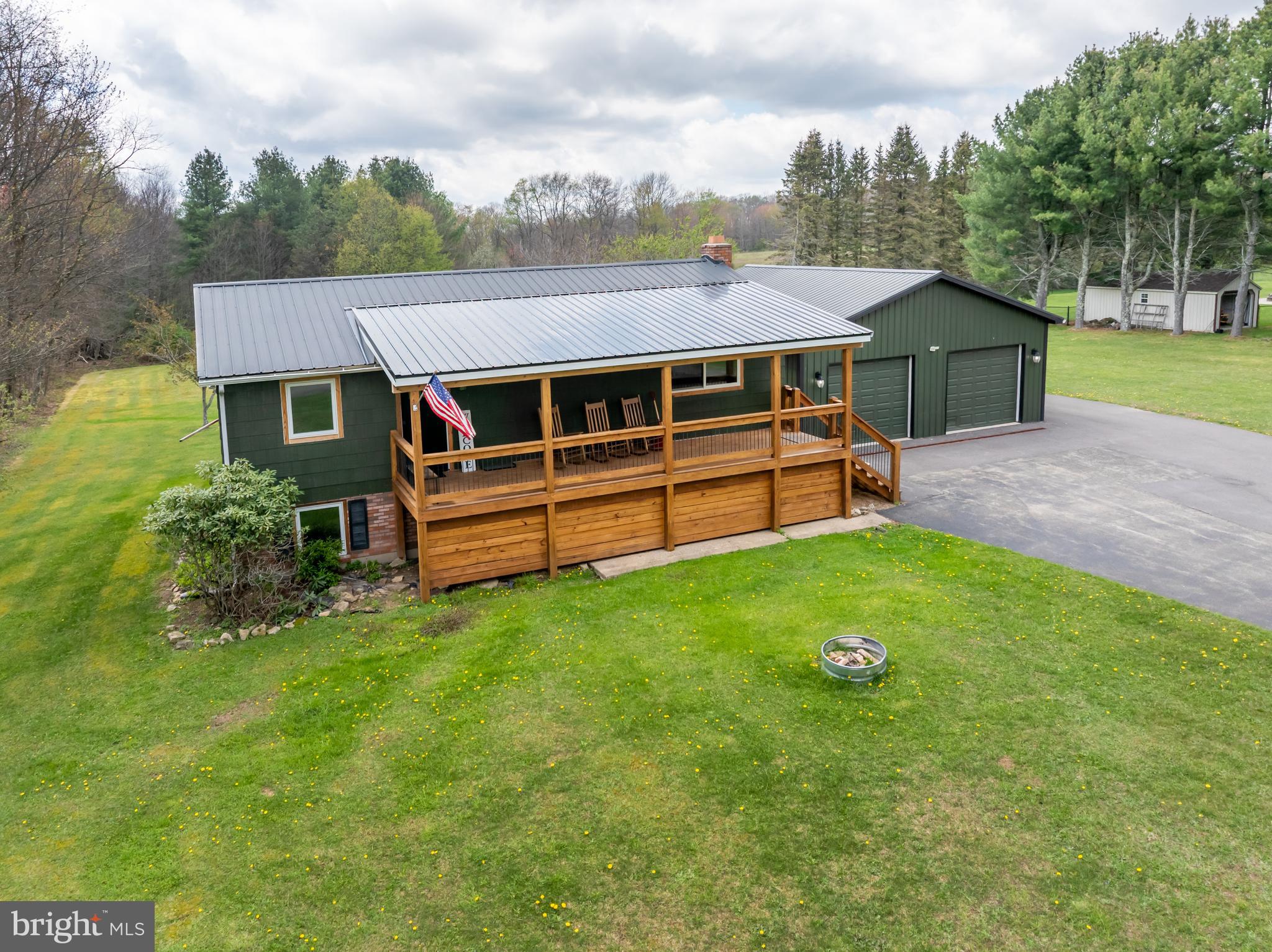 1015 Pysell Road McHenry, MD 21541 - Photo 50 of 56 a view of a house with a backyard