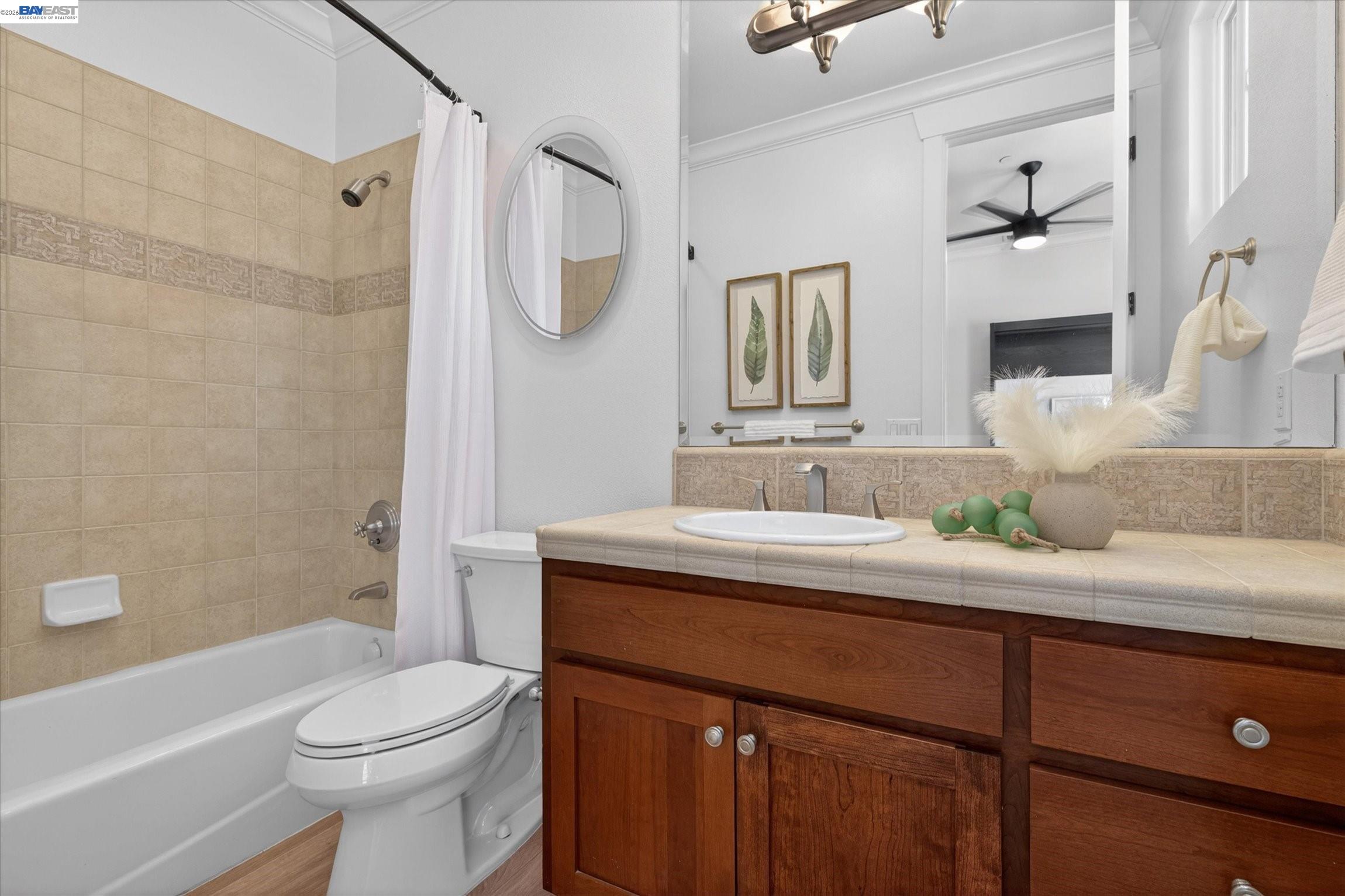 932 Hansen Road Livermore, CA 94550 - Photo 48 of 74 a bathroom with a granite countertop sink a toilet a mirror and shower