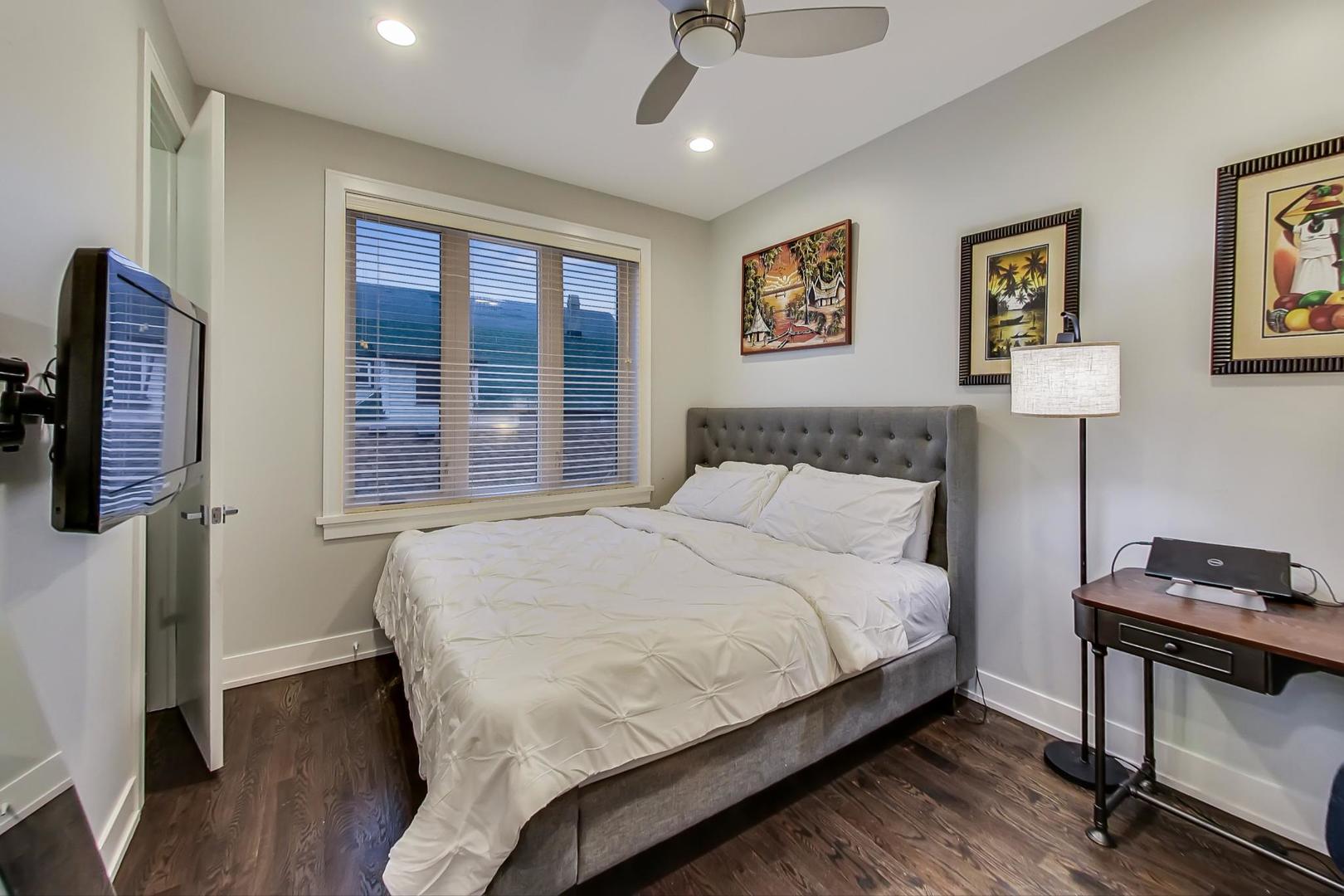 2339 North Drake Avenue Chicago, IL 60647 - Photo 12 of 29 a bedroom with a bed a couch and a window