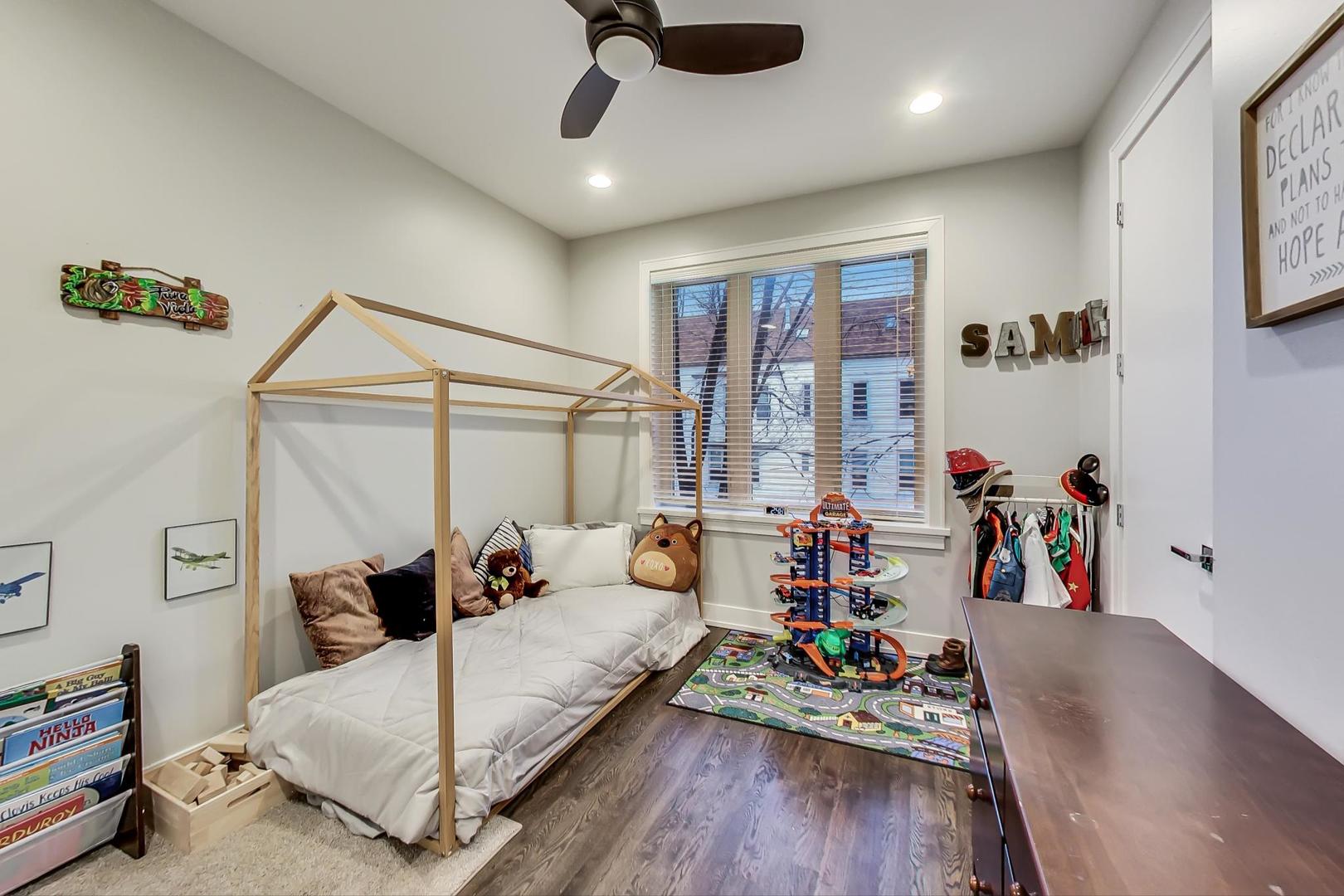 2339 North Drake Avenue Chicago, IL 60647 - Photo 14 of 29 a bedroom with bed and wooden floor