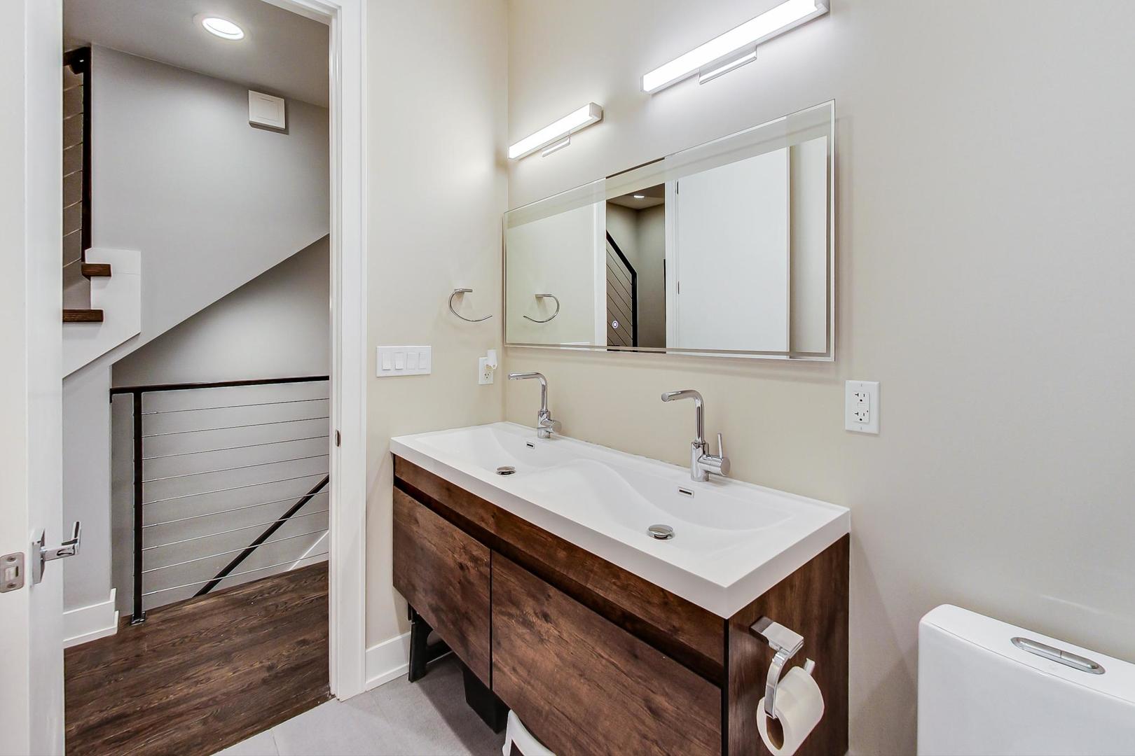 2339 North Drake Avenue Chicago, IL 60647 - Photo 16 of 29 a bathroom with a sink and a mirror