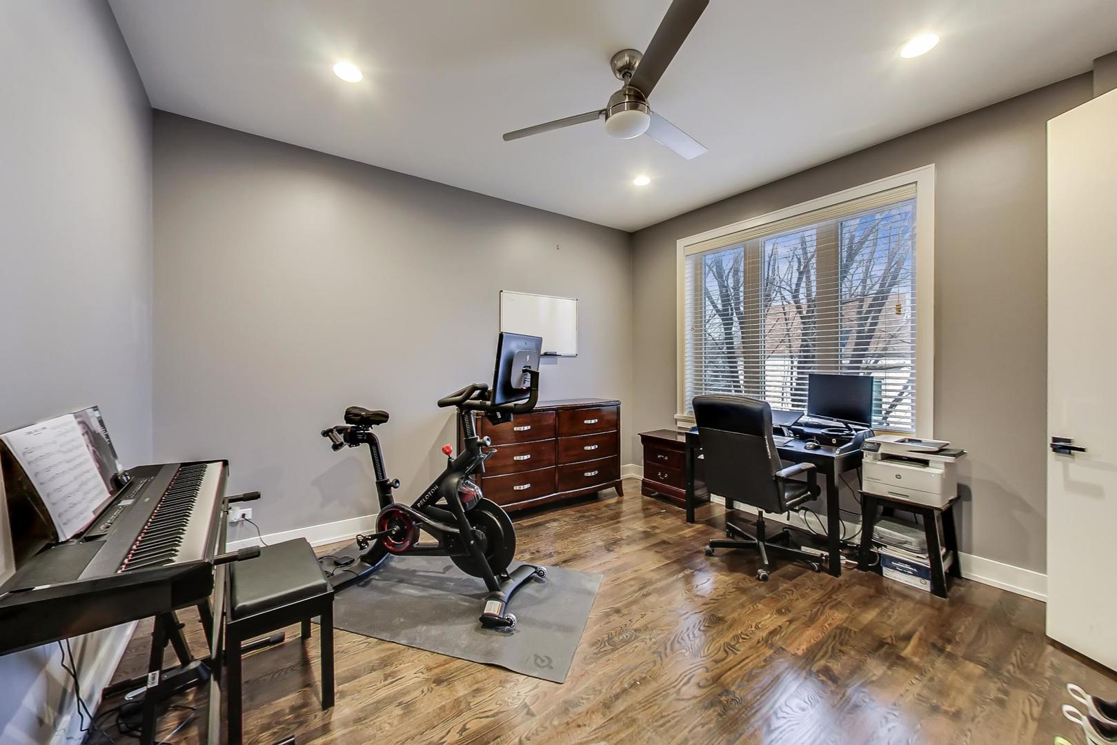 2339 North Drake Avenue Chicago, IL 60647 - Photo 19 of 29 a view of a workspace with furniture and a window
