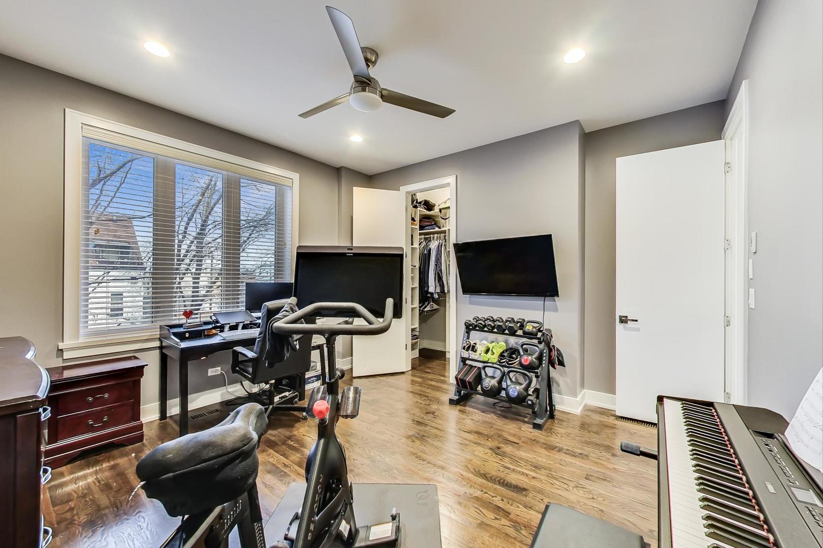 2339 North Drake Avenue Chicago, IL 60647 - Photo 21 of 29 a view of a livingroom with workspace window and wooden floor