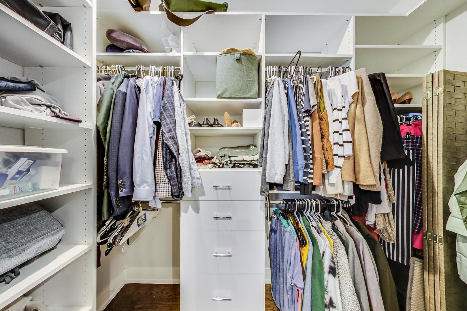 2339 North Drake Avenue Chicago, IL 60647 - Photo 22 of 29 a view of walk in closet with clothes and shoes