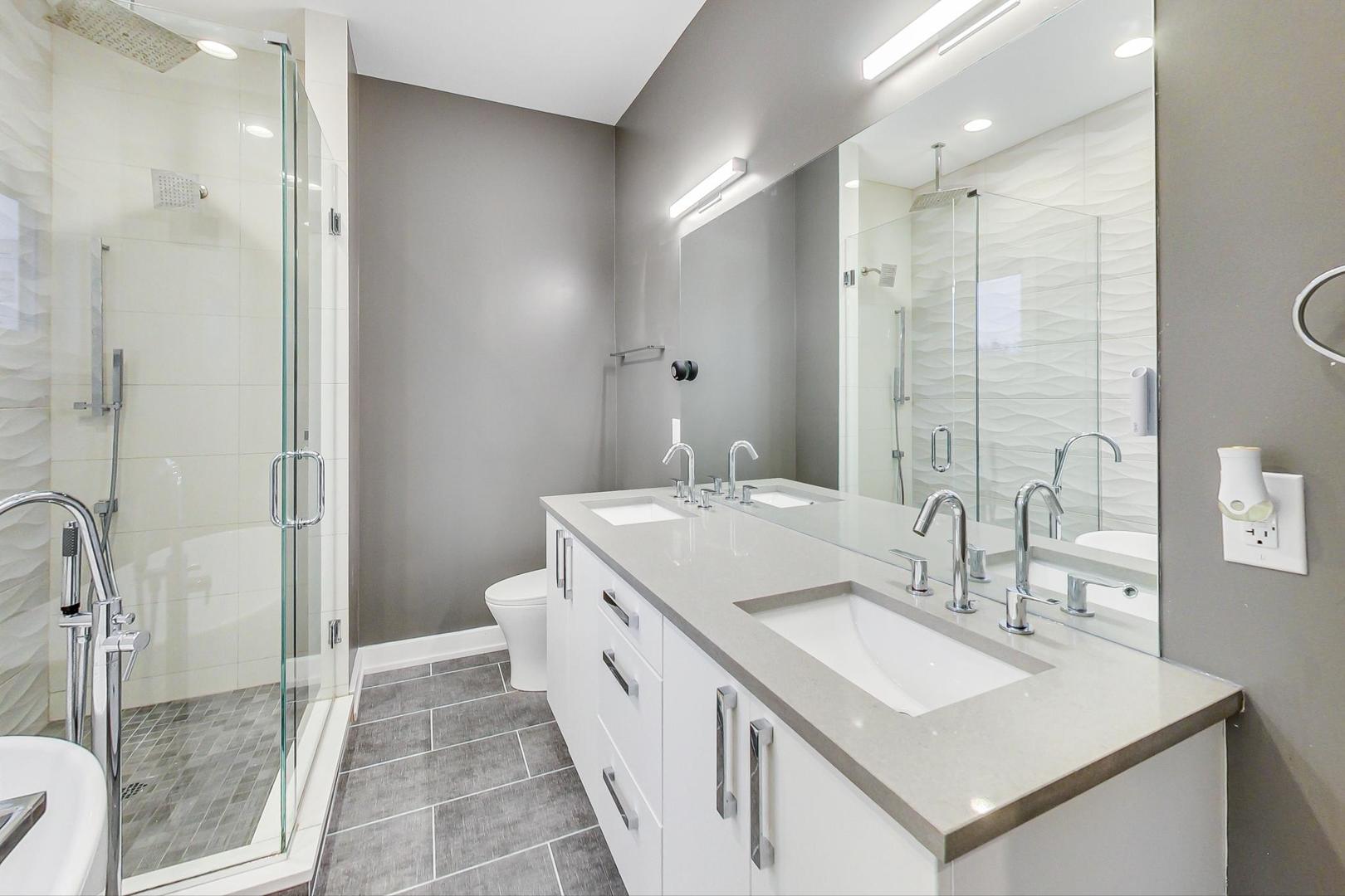 2339 North Drake Avenue Chicago, IL 60647 - Photo 23 of 29 a bathroom with a sink a toilet and shower
