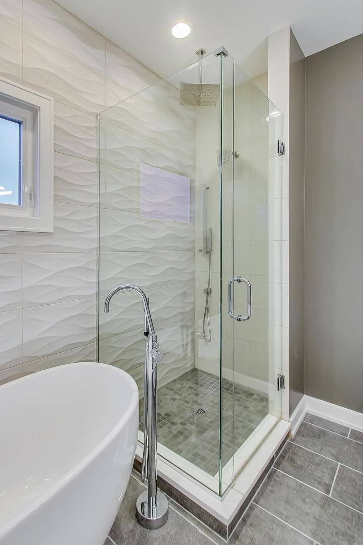 2339 North Drake Avenue Chicago, IL 60647 - Photo 24 of 29 a bathroom with a bathtub and a shower