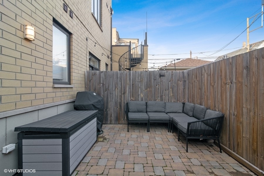 2339 North Drake Avenue Chicago, IL 60647 - Photo 27 of 29 a patio with patio couch and outdoor seating