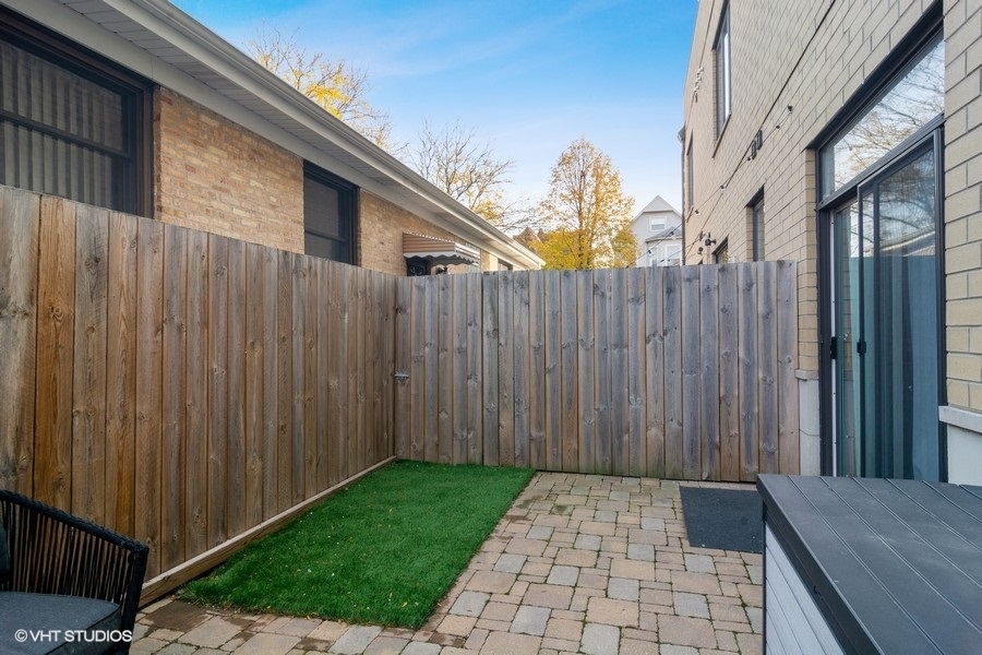 2339 North Drake Avenue Chicago, IL 60647 - Photo 28 of 29 a view of a backyard with wooden fence