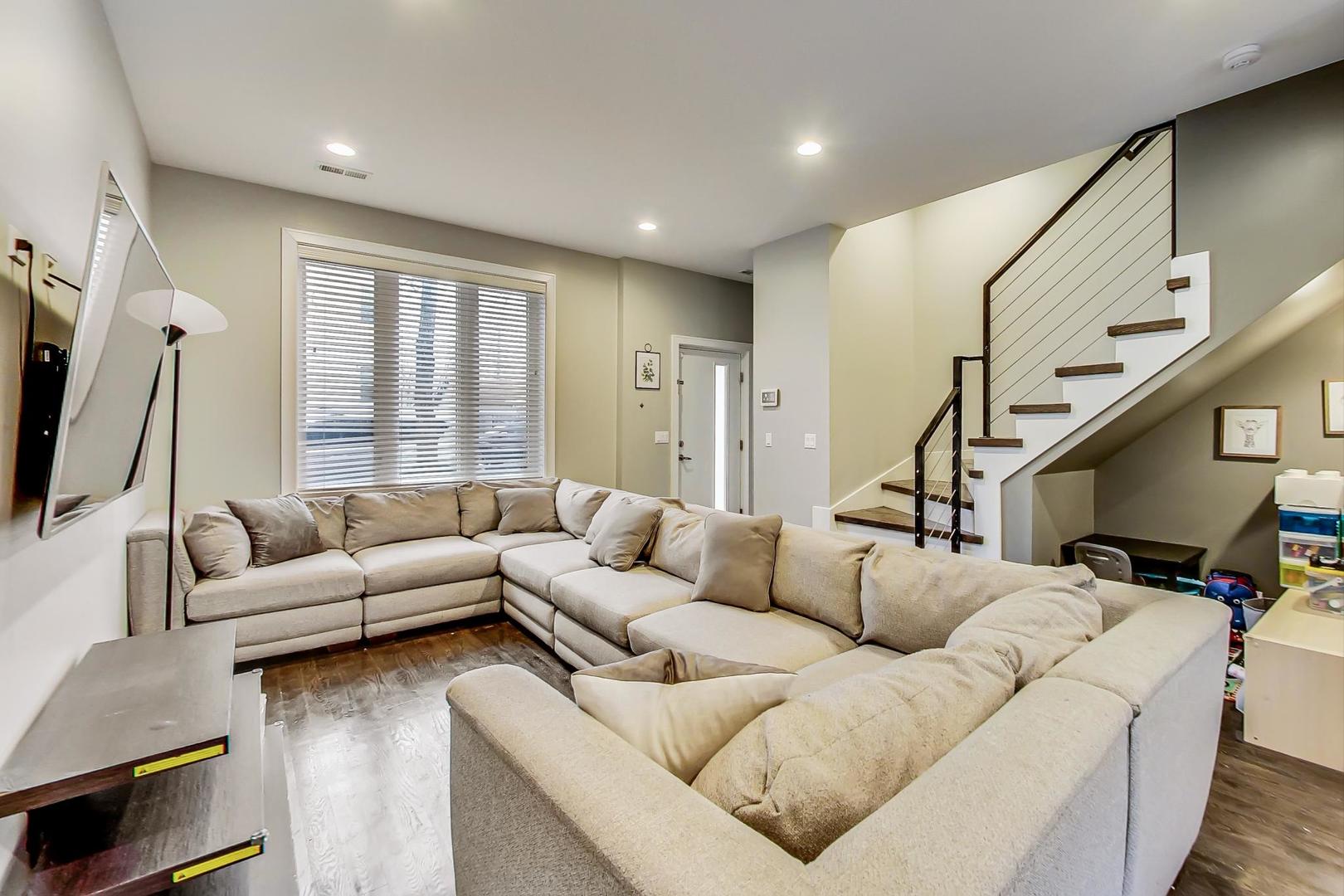 2339 North Drake Avenue Chicago, IL 60647 - Photo 5 of 29 a living room with furniture and a flat screen tv