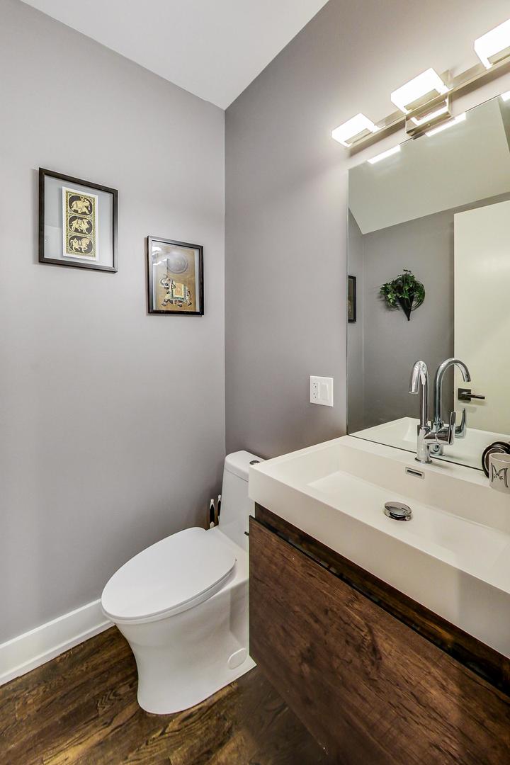 2339 North Drake Avenue Chicago, IL 60647 - Photo 10 of 29 a bathroom with a sink and a mirror