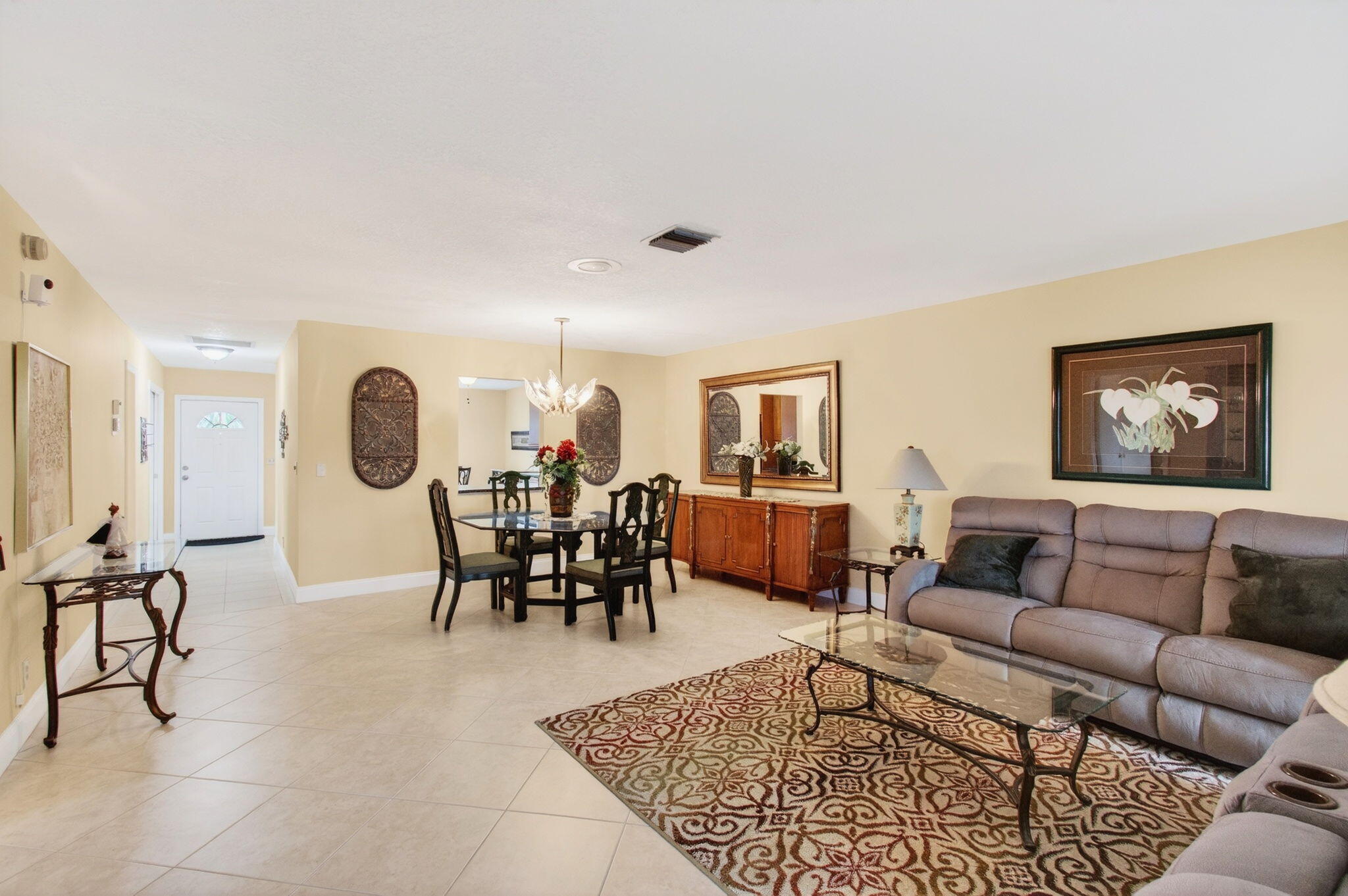 5263 Privet Place, Unit D Delray Beach, FL 33484 - Photo 14 of 60 a living room with furniture a rug and a window
