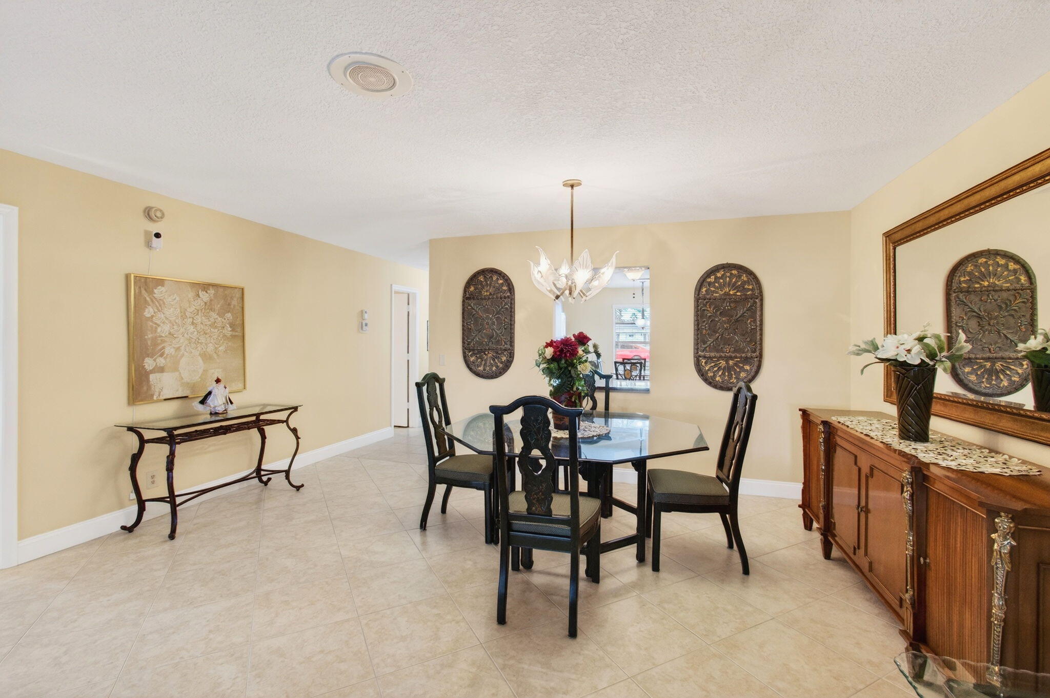 5263 Privet Place, Unit D Delray Beach, FL 33484 - Photo 16 of 60 a view of a dining room and a table and chairs in wooden floor