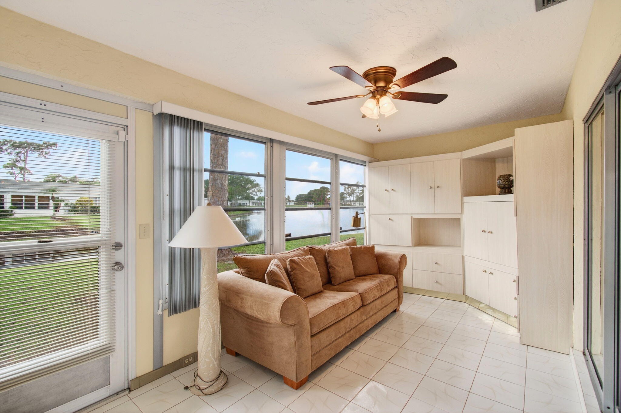 5263 Privet Place, Unit D Delray Beach, FL 33484 - Photo 18 of 60 a living room with furniture and a large window