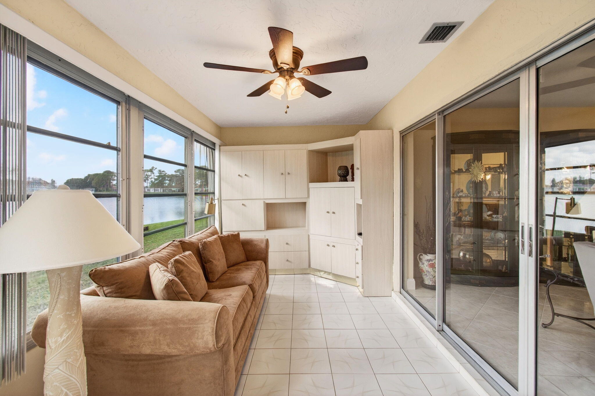 5263 Privet Place, Unit D Delray Beach, FL 33484 - Photo 19 of 60 a living room with furniture and a large window