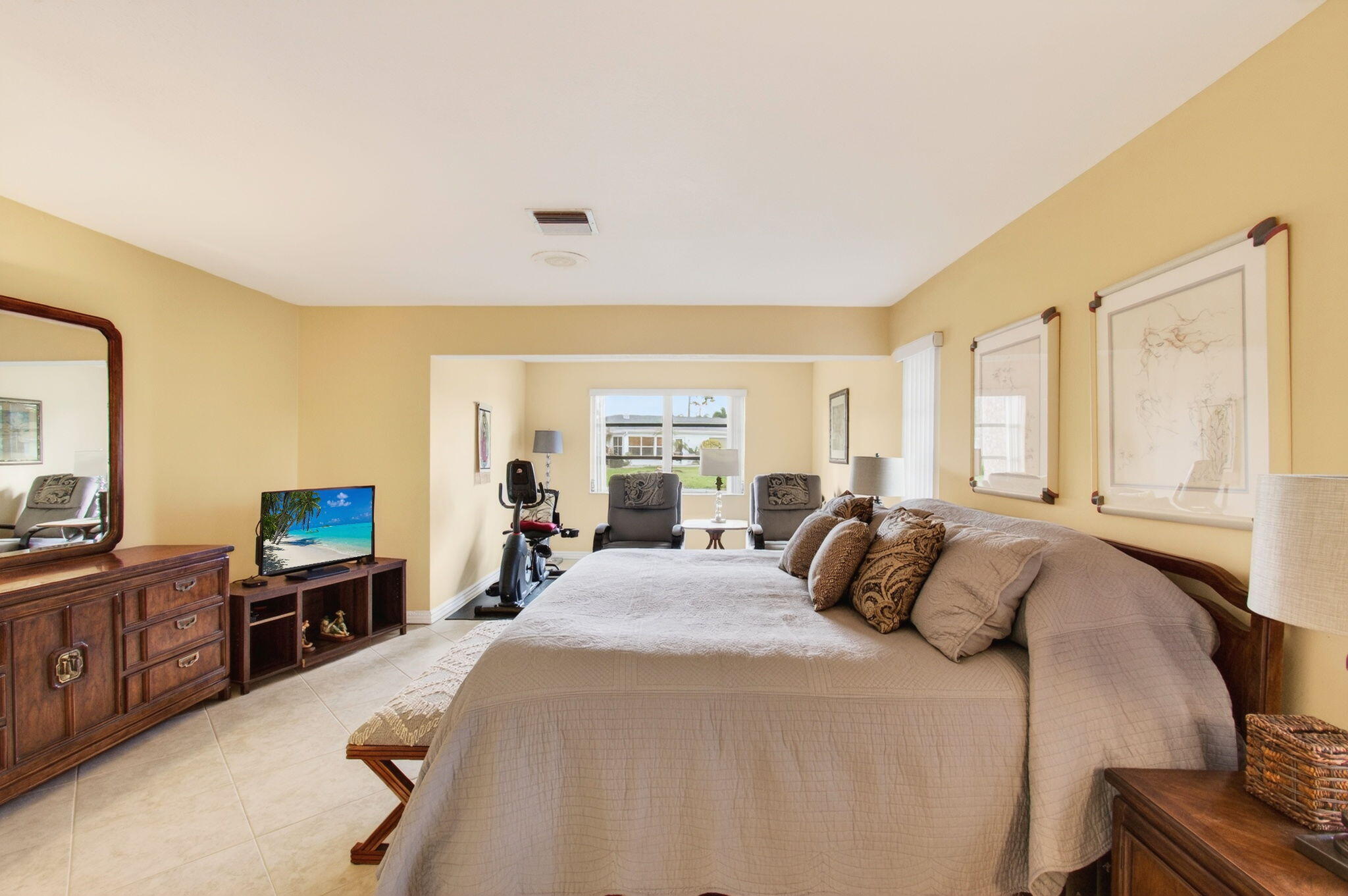 5263 Privet Place, Unit D Delray Beach, FL 33484 - Photo 23 of 60 a bedroom with a bed and furniture