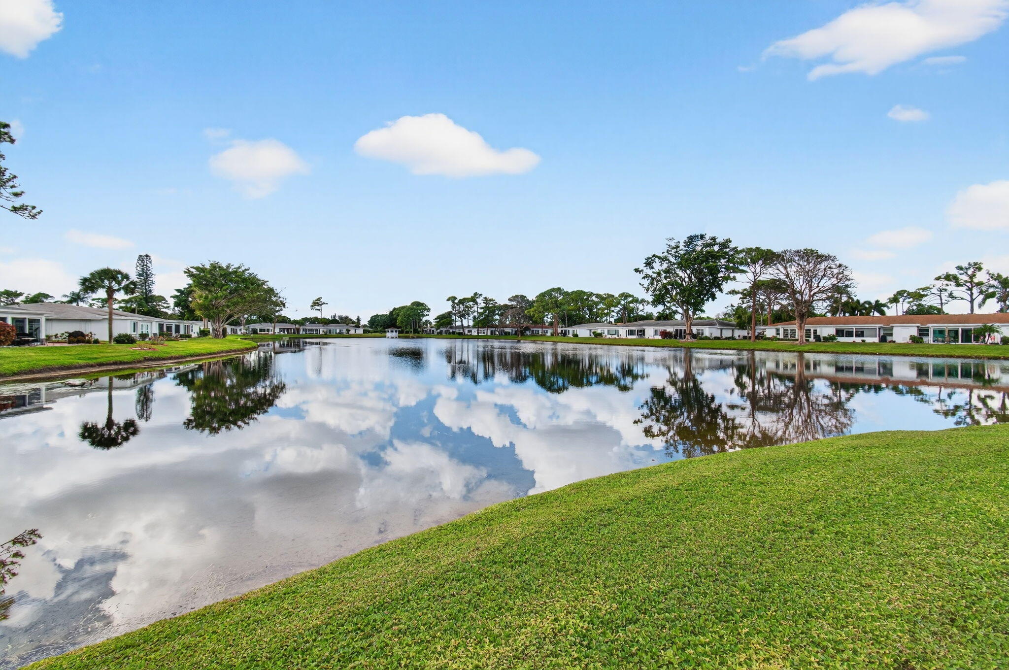 5263 Privet Place, Unit D Delray Beach, FL 33484 - Photo 40 of 60 a view of a lake with houses